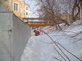 Вид здания структуры Газпрома с адресом «улица Крылова, 6/2» (он же: «переулок Аптекарский, 4») при виде переулка Аптекарского со стороны улицы Крылова. Здание — слева.