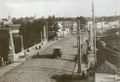 Вид на начало Набережной реки Ушайки в 1927 году — в момент проезда по Каменному мосту городского пассажирского автобуса модели FIAT